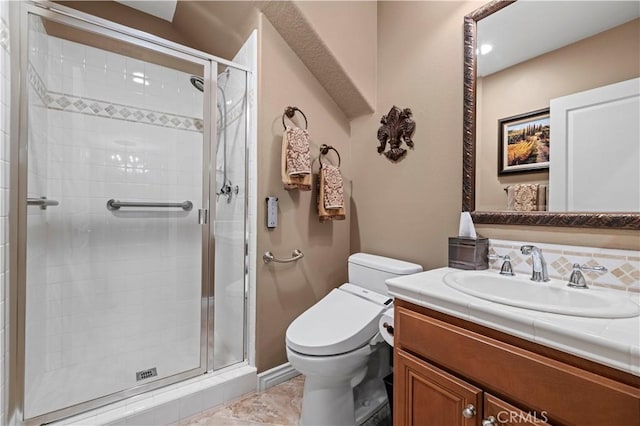 full bath with vanity, toilet, and a shower stall