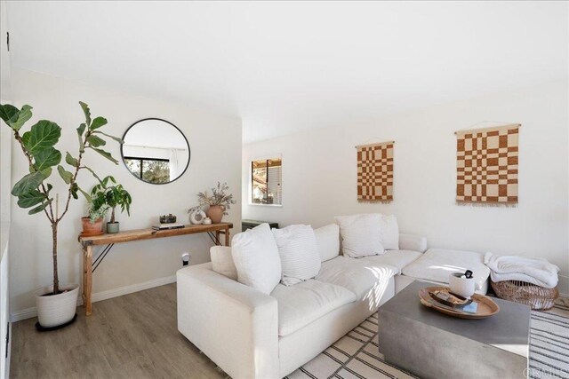 living room with light wood-style floors and baseboards