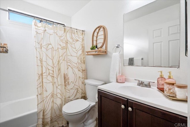 bathroom featuring toilet, vanity, and shower / bath combo