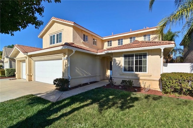 mediterranean / spanish-style home with a tile roof, fence, and stucco siding