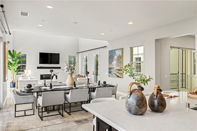 dining area with recessed lighting, visible vents, and french doors