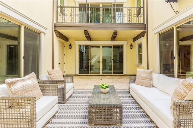 view of patio / terrace with an outdoor living space and a balcony