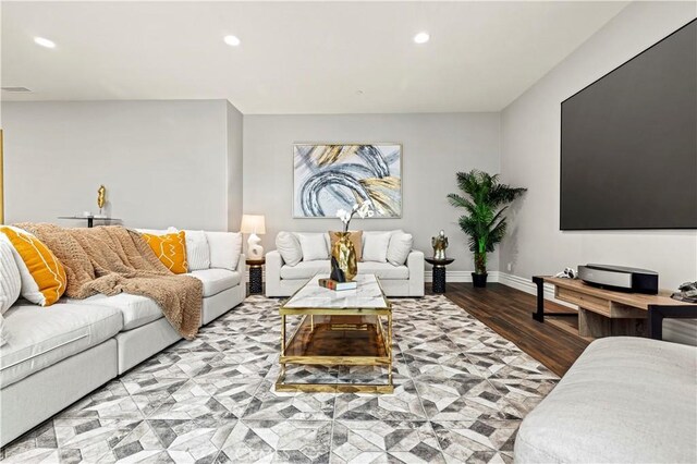 living area featuring wood finished floors, recessed lighting, visible vents, and baseboards