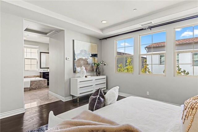 bedroom featuring recessed lighting, wood finished floors, visible vents, and baseboards