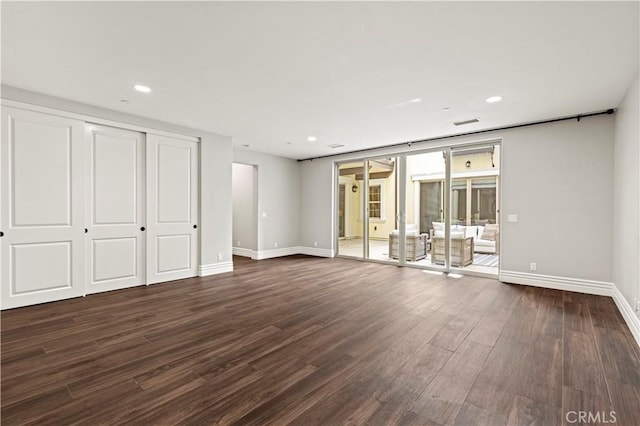 unfurnished bedroom with visible vents, recessed lighting, baseboards, and dark wood-style flooring