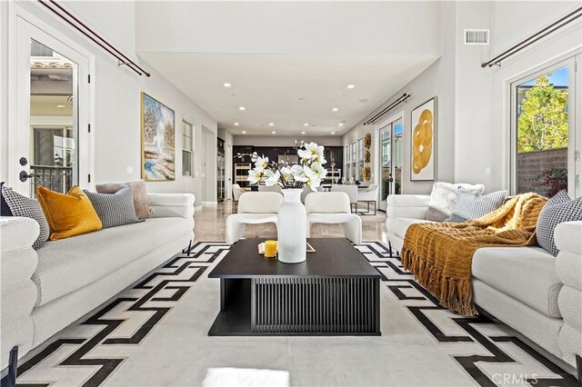 living area with recessed lighting and visible vents