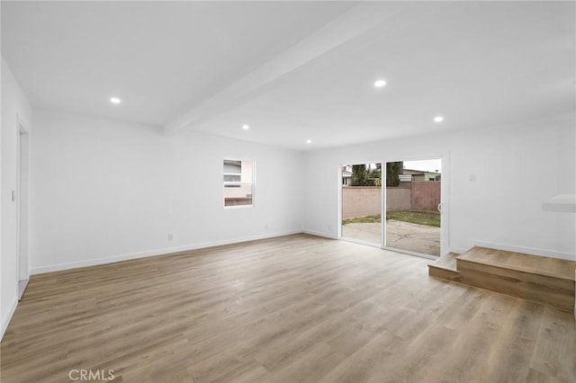 unfurnished room with recessed lighting, baseboards, beam ceiling, and light wood finished floors