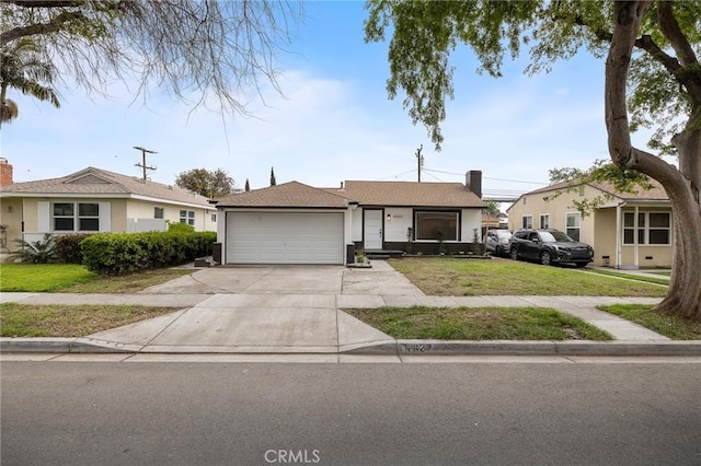 single story home featuring a front yard, a garage, driveway, and stucco siding