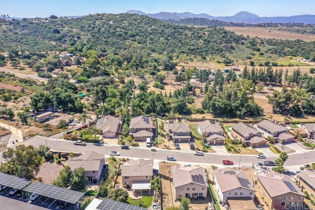 drone / aerial view featuring a mountain view and a residential view