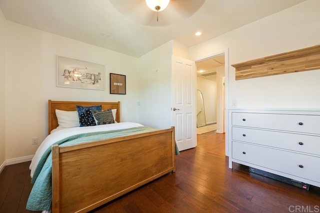 bedroom with recessed lighting, baseboards, and dark wood finished floors