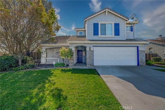 traditional home with fence, driveway, a porch, a front lawn, and a garage