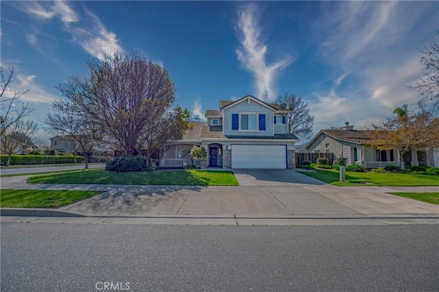 view of front of house with a front yard, an attached garage, and concrete driveway