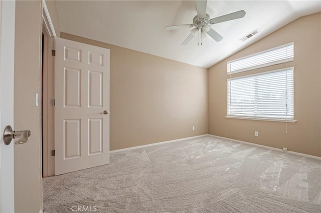 carpeted empty room with visible vents, ceiling fan, baseboards, and lofted ceiling