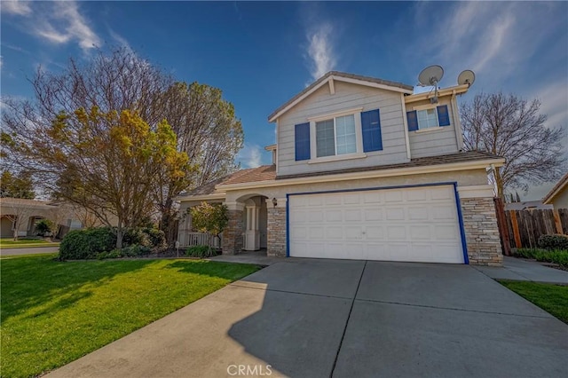 traditional-style home with a front yard, fence, an attached garage, concrete driveway, and stone siding