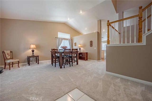 carpeted dining area with stairs, recessed lighting, baseboards, and high vaulted ceiling