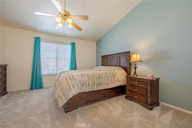 carpeted bedroom with lofted ceiling, baseboards, and ceiling fan