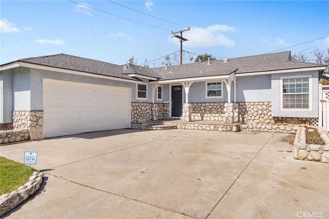 view of front of home featuring stone siding, stucco siding, an attached garage, and a shingled roof