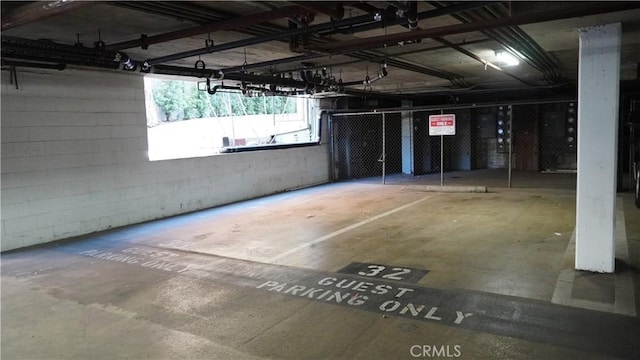 parking deck featuring concrete block wall