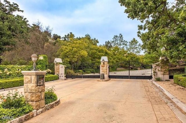 view of gate featuring fence