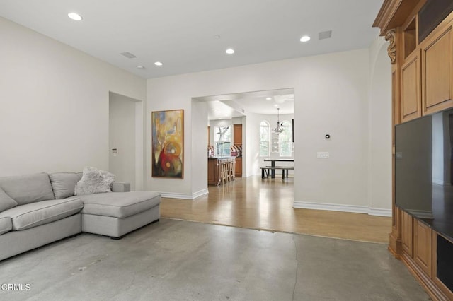 living room featuring a chandelier, baseboards, visible vents, and recessed lighting