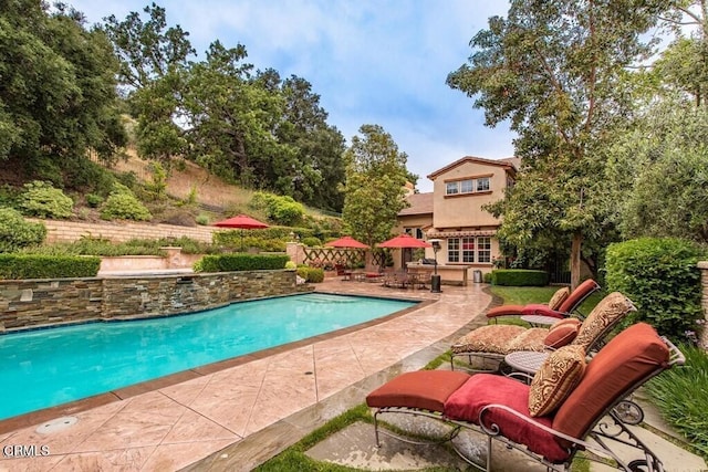 pool with a patio area