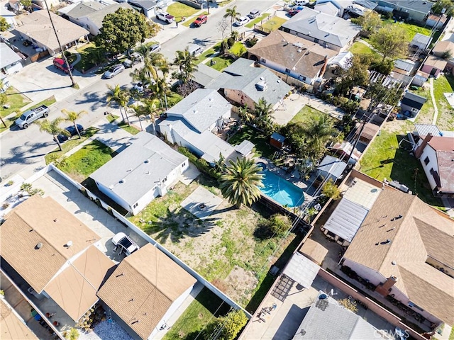 birds eye view of property with a residential view