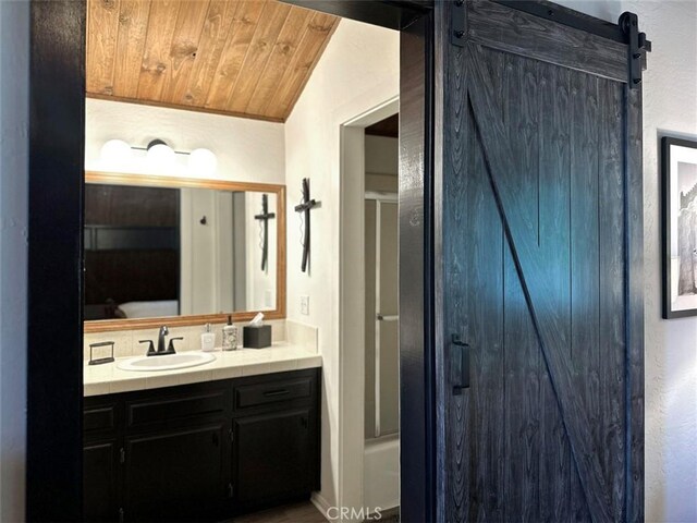 full bathroom with a shower, wooden ceiling, and vanity