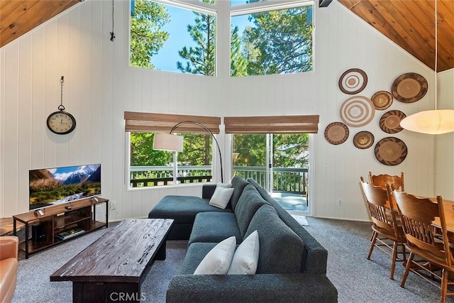 living room featuring wooden ceiling, carpet flooring, and high vaulted ceiling