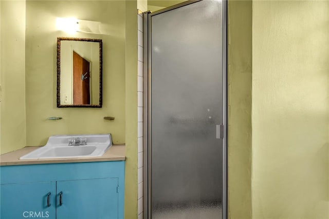 full bathroom featuring vanity and a stall shower