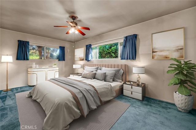 carpeted bedroom with ceiling fan