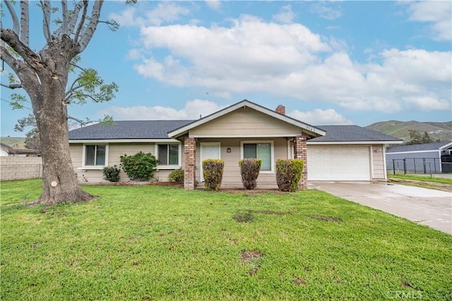 ranch-style house with a front lawn, fence, concrete driveway, an attached garage, and a chimney