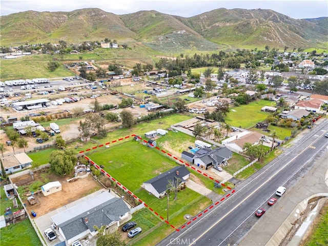 birds eye view of property featuring a mountain view