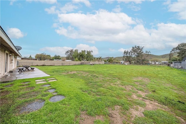 view of yard with a patio area and fence