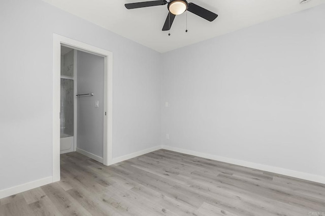 unfurnished bedroom with baseboards, a ceiling fan, and wood finished floors