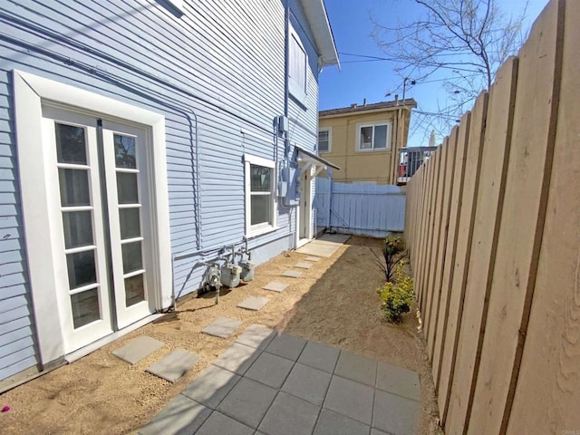 view of home's exterior featuring fence