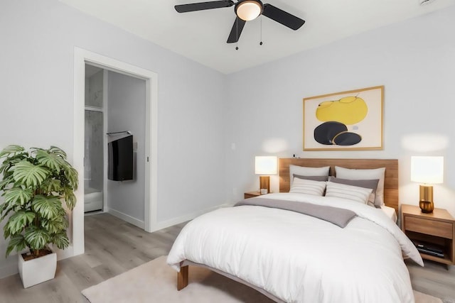 bedroom with light wood-style floors, baseboards, and ceiling fan