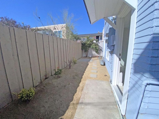 view of side of home featuring a fenced backyard