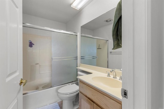 full bath with combined bath / shower with glass door, toilet, and vanity