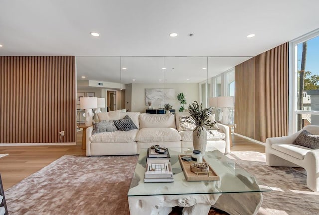 living room with recessed lighting and wood finished floors