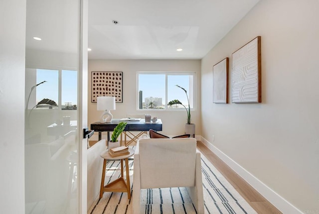 office space with recessed lighting, baseboards, and light wood-style floors