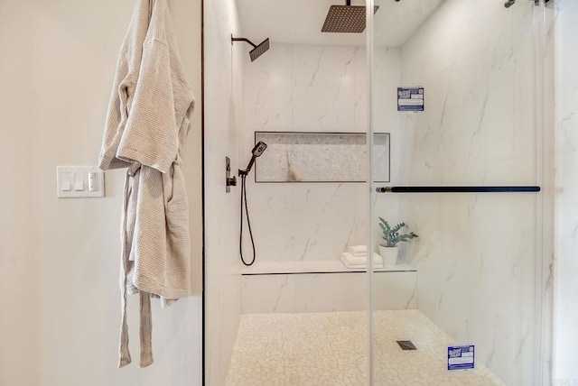 full bath featuring a marble finish shower