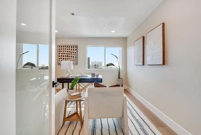 office area with light wood finished floors, baseboards, and recessed lighting