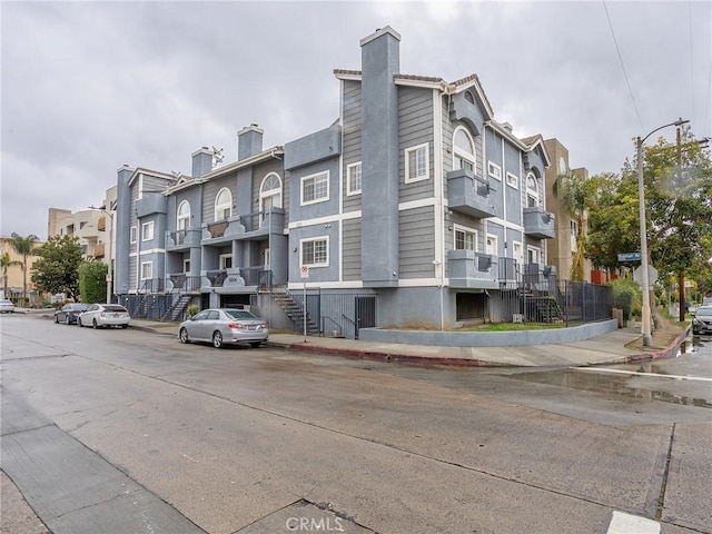 view of building exterior with a residential view