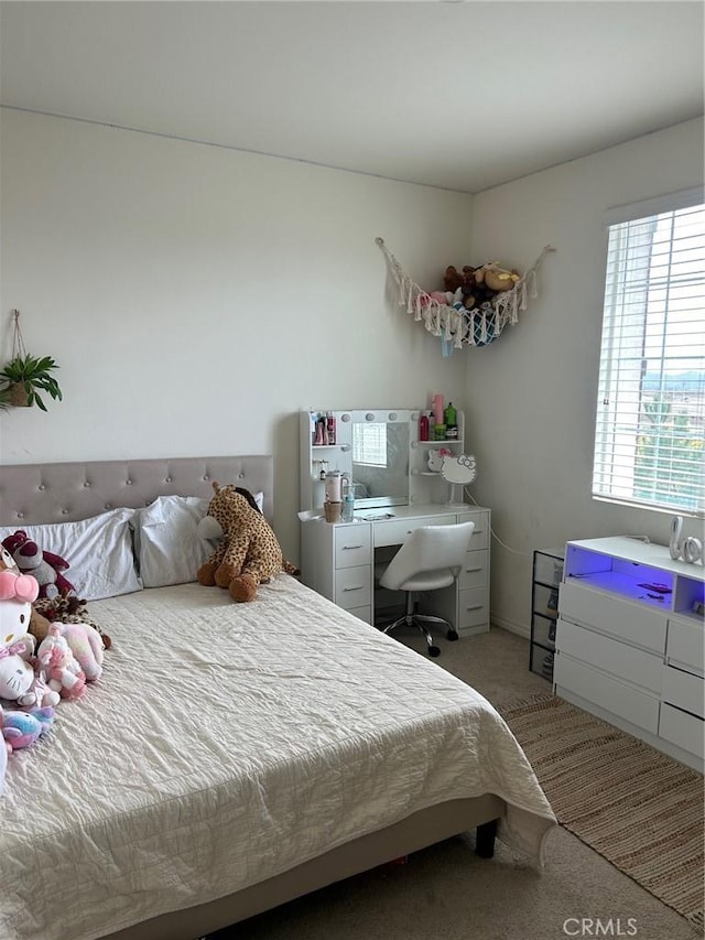 bedroom with light carpet