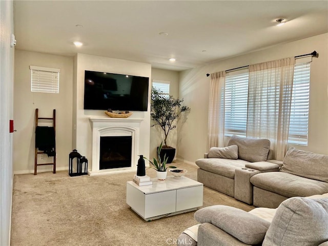 3204 E Denali Dr, Ontario, CA 91762 - living area featuring recessed lighting, a fireplace with raised hearth, baseboards, and light carpet