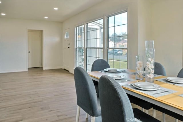 dining area featuring plenty of natural light, wood finished floors, recessed lighting, and baseboards