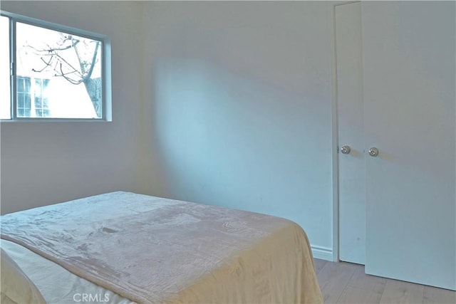 bedroom with light wood-style floors