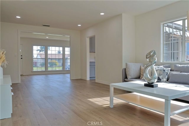 interior space with recessed lighting, visible vents, baseboards, and light wood finished floors