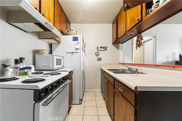 kitchen featuring under cabinet range hood, a sink, white appliances, light tile patterned flooring, and light countertops