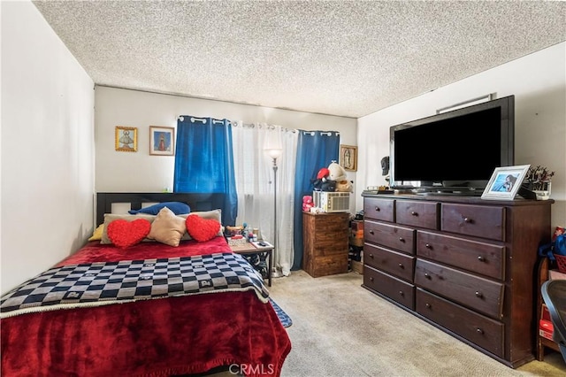 carpeted bedroom with a textured ceiling